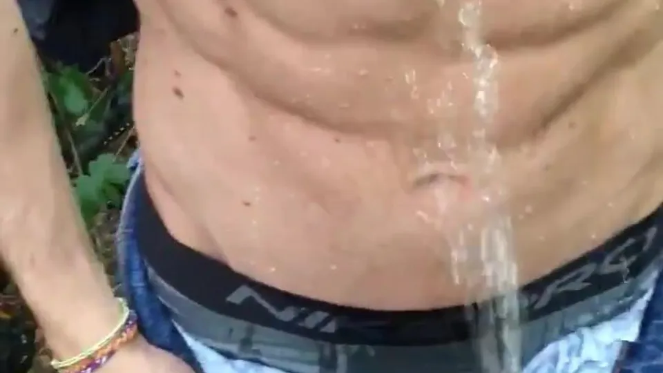 Muscular Man Hosed Down