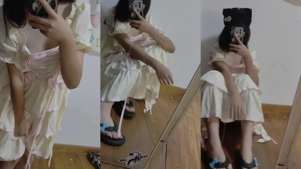 Small-breasted slutty girl looks in the mirror in a vacuum dress 