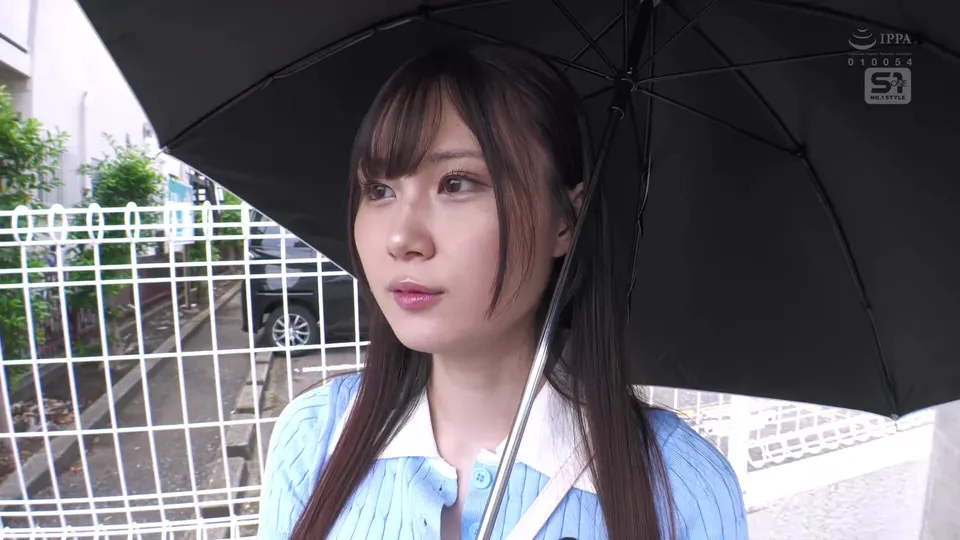 Asian Girl in Blue Shirt Holds Umbrella