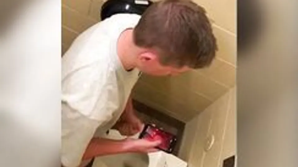 Spying on 2 hunks jerking off in the toilet