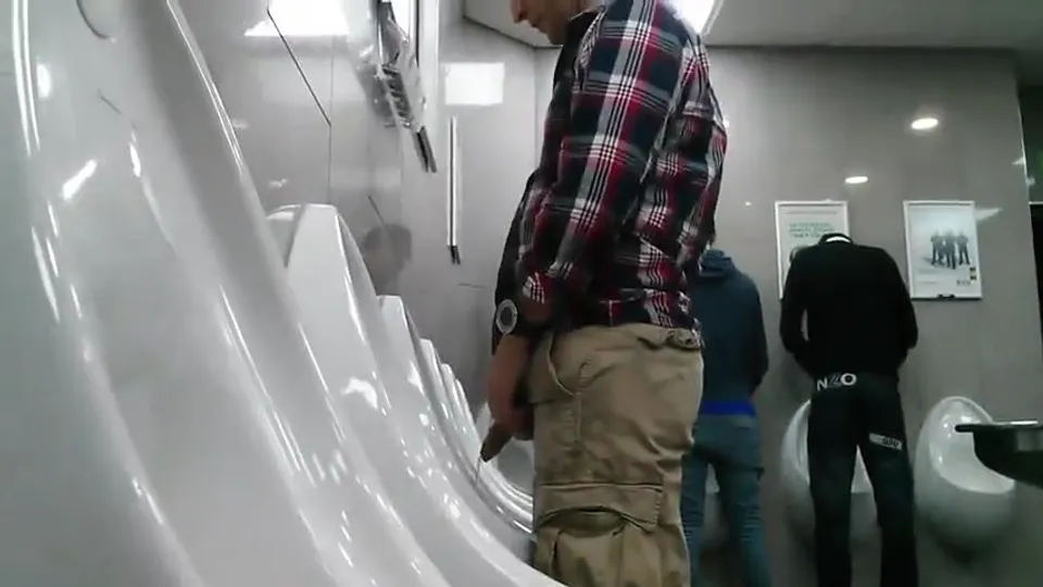 Spying on big dick guy pissing - ThisVid.com