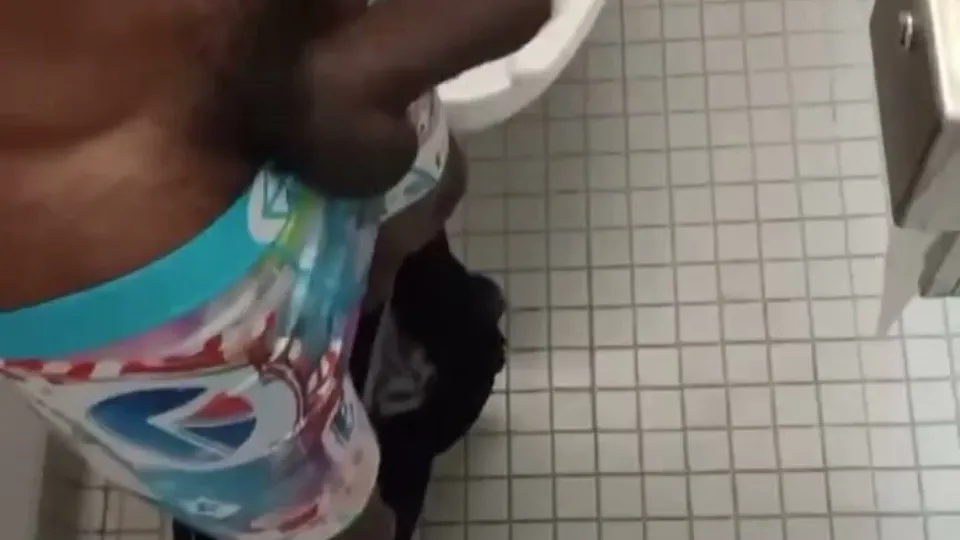 Stroking his massive bbc in bathroom stall - ThisVid.com