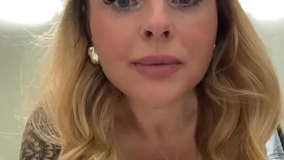 Tattooed Blonde Teases in Locker Room