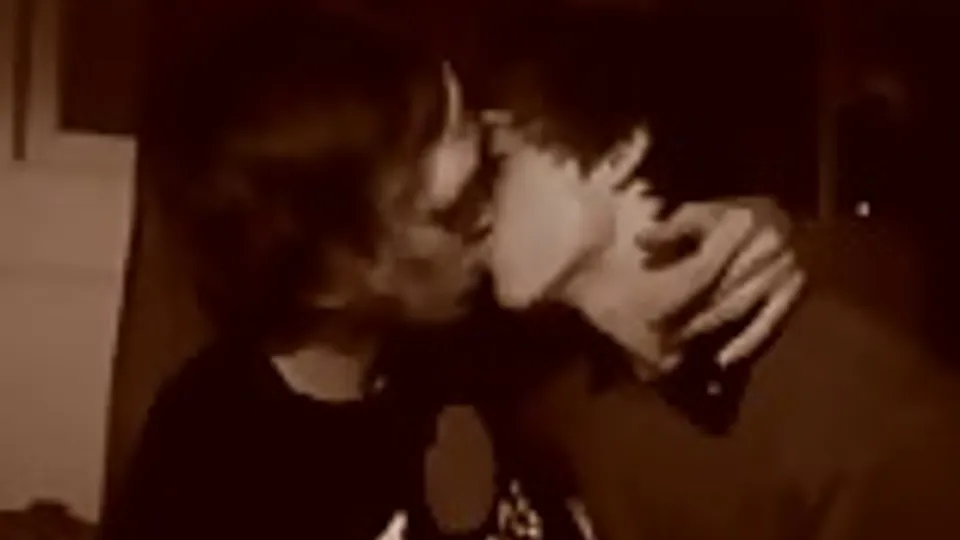 Teen boys kissing