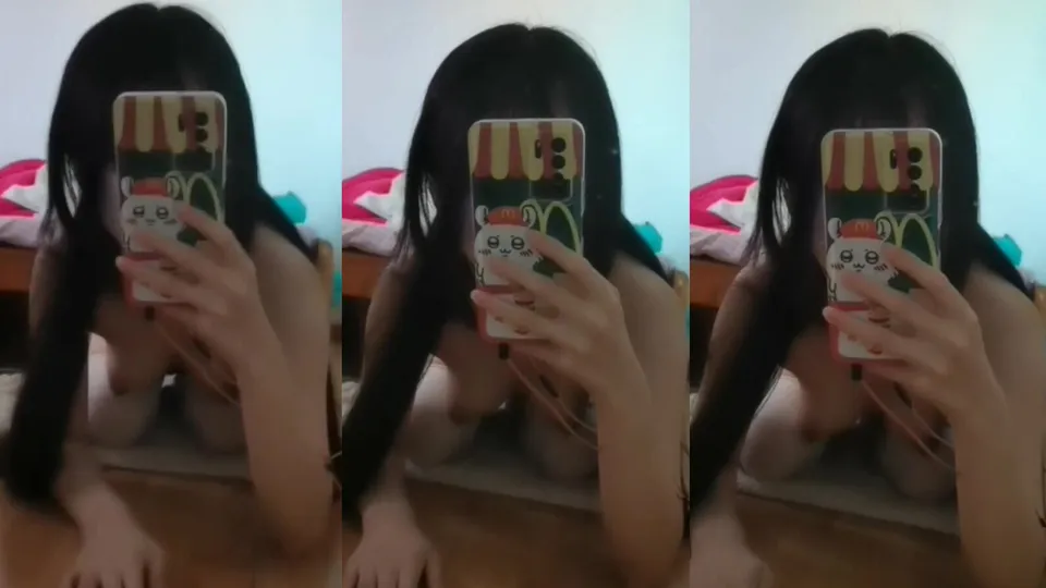 The li*** bitch with white stockings takes a selfie in the mirror  