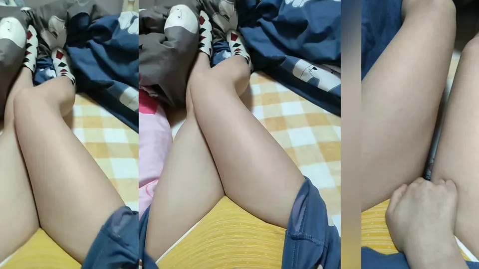 The sexy girl with glasses shows her panties and grabs her breasts 