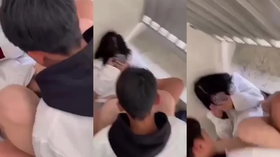 The student secretly eats the forbidden fruit at the entrance of the stairs. The friend helps to push 