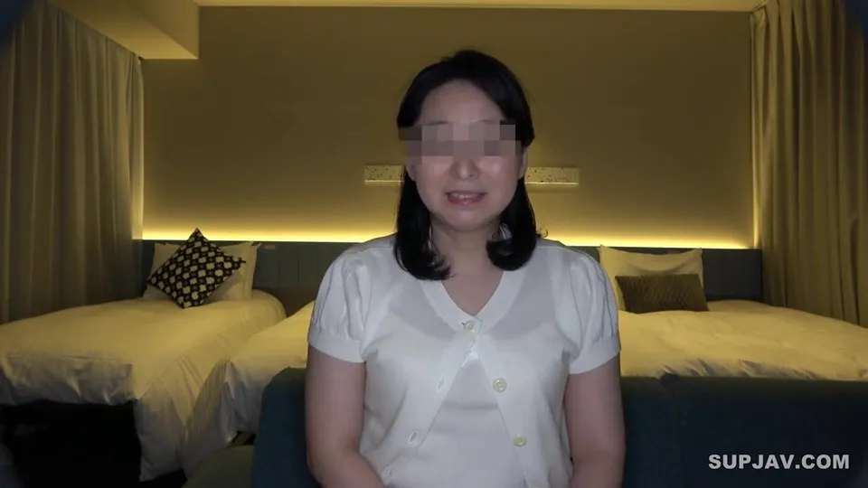 asian woman in white blouse sitting in hotel room with two beds