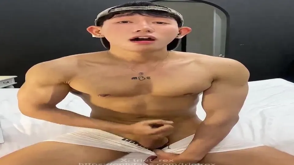 Muscular Asian Men in Bedroom Encounter