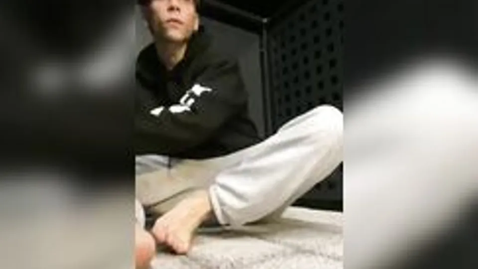 Twink strips naked on public balcony