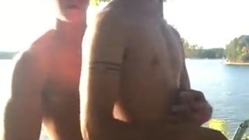 Two guys suck and fuck raw by the lake
