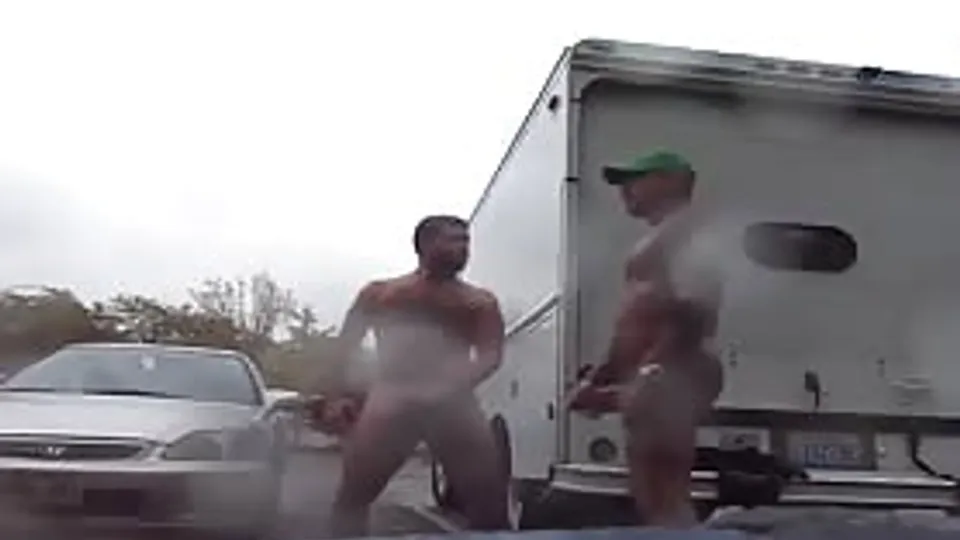 Two strangers masturbate in a public parking lot