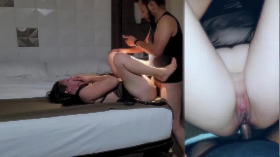 dominant man overpowers submissive woman on bed