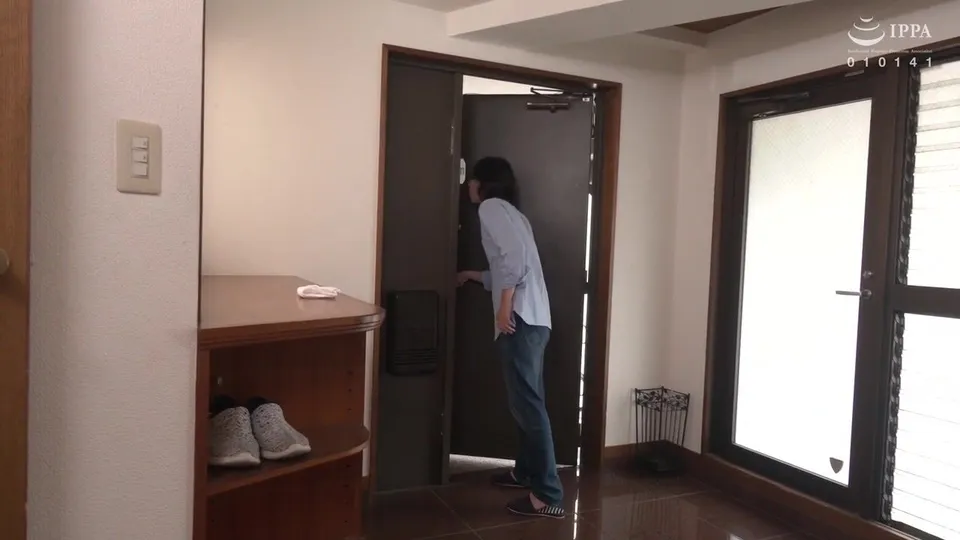 Man in blue shirt explores dark room solo