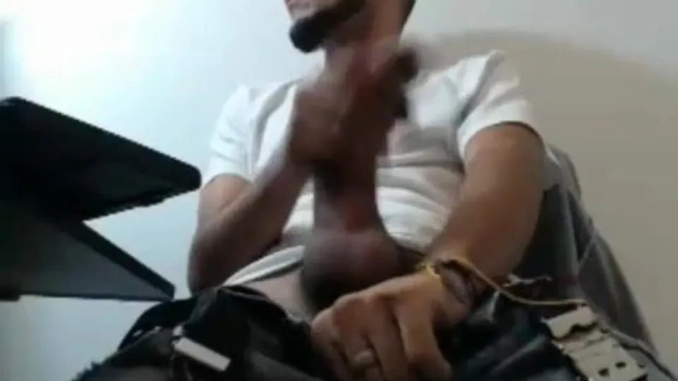 man using large dildo while working on laptop