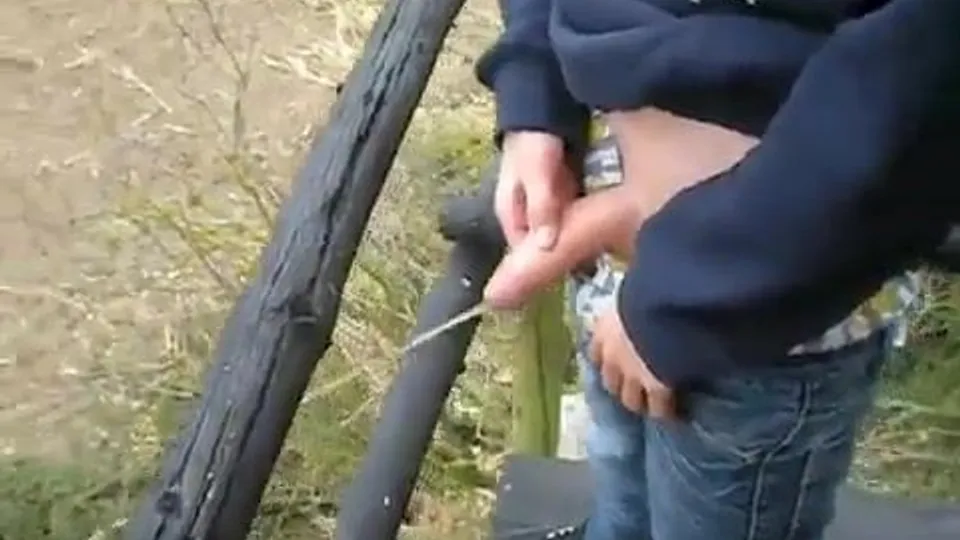 Young Man Pisses in Nature