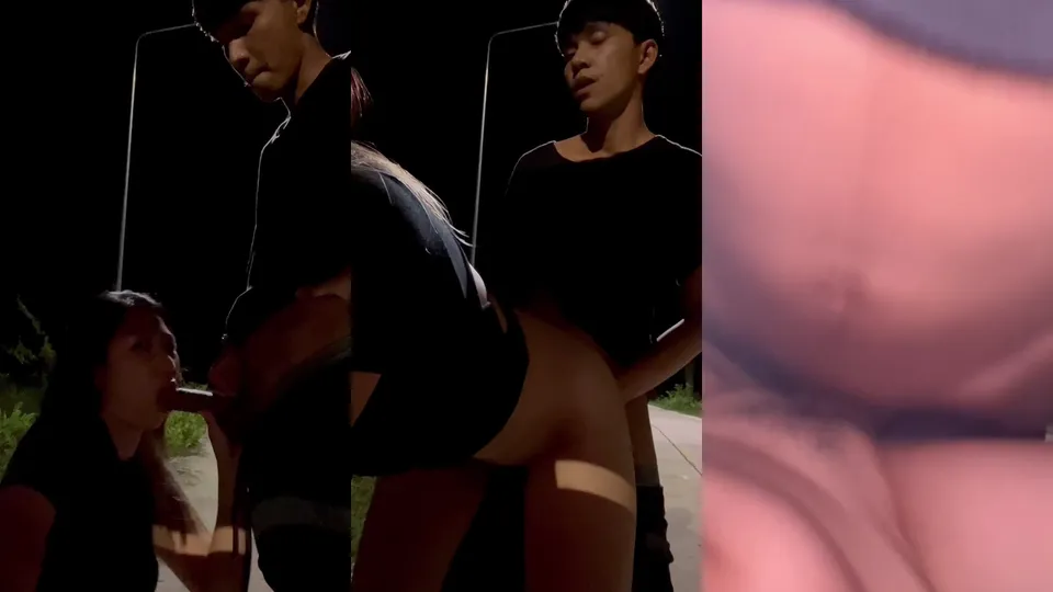 Young Thai couple taking selfie while having sex outdoors 