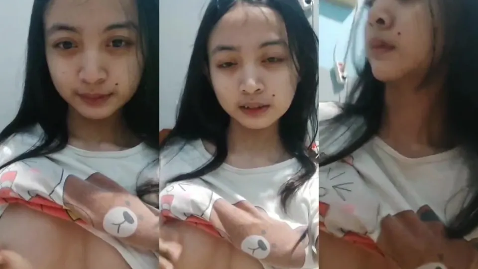 Young woman showing her breasts and showing off 